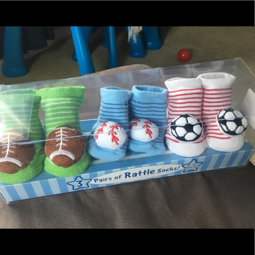 3 pairs of newborn/infant socks with rattlers.